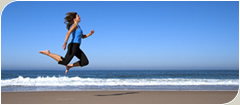 Woman jumping on a beach